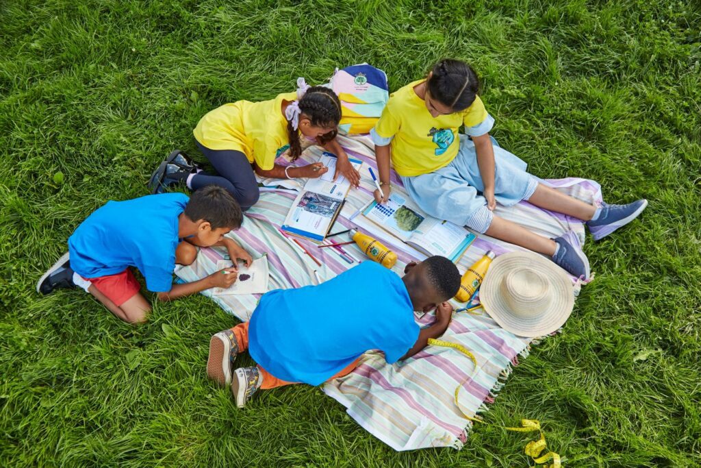 Children take part in the Green Tree Badge challenge
